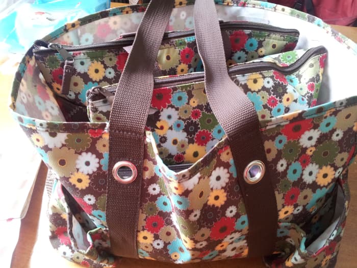 My favorite diaper bag is my Thirty One Organizing Utility Tote. I also have a zipper bag and cooler inside to keep things neat.