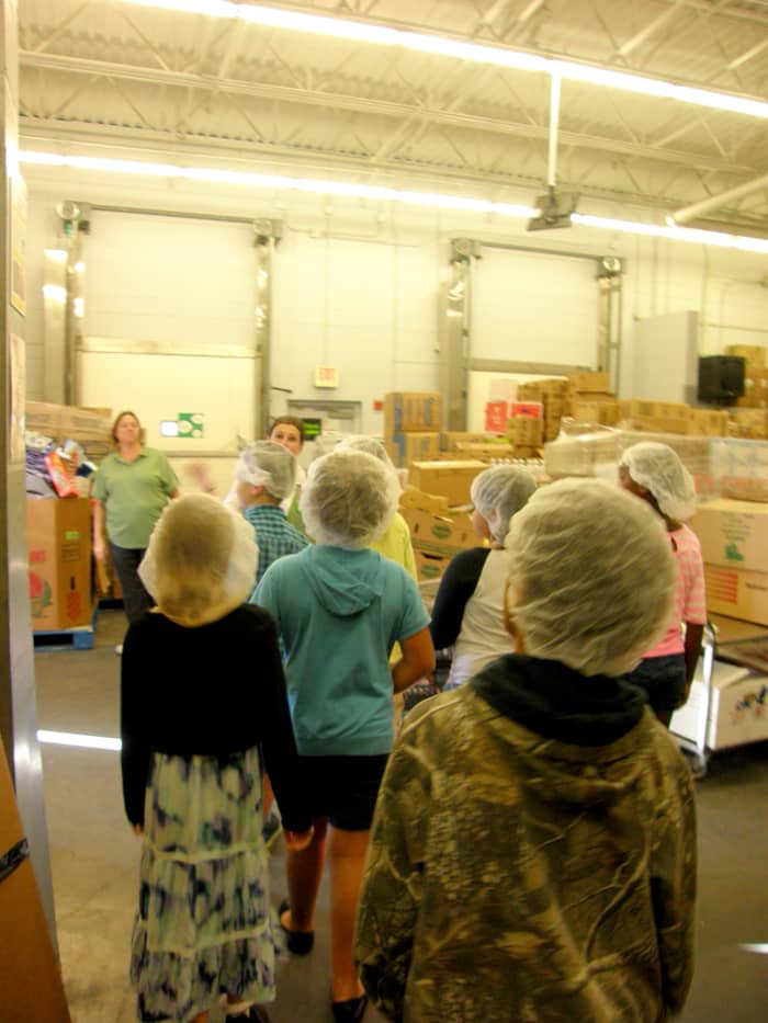 Students watched for a bit as a truck was loaded with food to take to one of the local food banks.