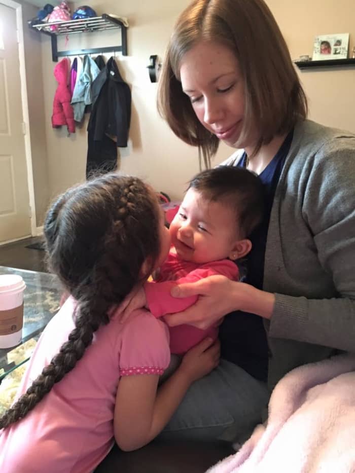 Taking care of older kids in addition to a newborn can be a whole new challenge. A baby wrap helped me survive the early months of having more than one child.