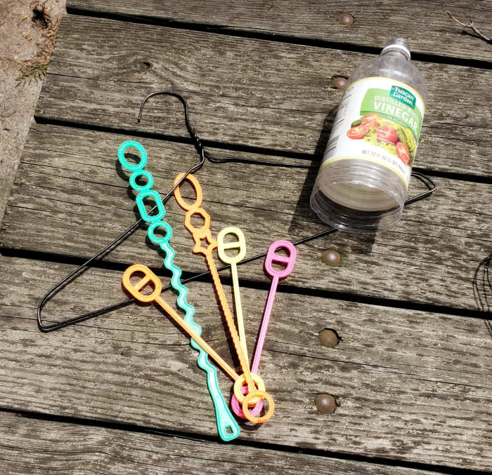 Get creative and experiment with different materials for wands. An old plastic bottle will make large circular bubbles. Try a wire coat hanger for a challenge!