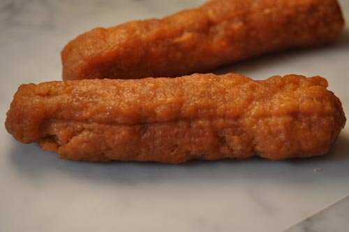 Rolls firmed up after refrigeration, ready for slicing.