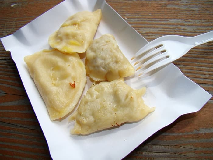 Though pierogi can come with all sorts of different fillings, my mother used a mixture of dry cottage cheese and chives bound together with a beaten egg.