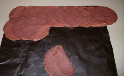 How to lay out beef slices. I like to use a sheet of tinfoil, which helps later when I'm ready to do the rolling.