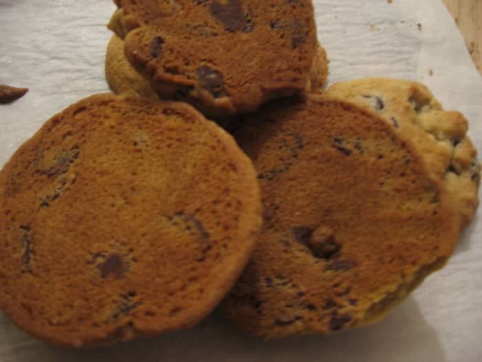 The finished chocolate chip walnut cookies. The bottom side's perfect coloring suggests moist, chewy, light crispiness.