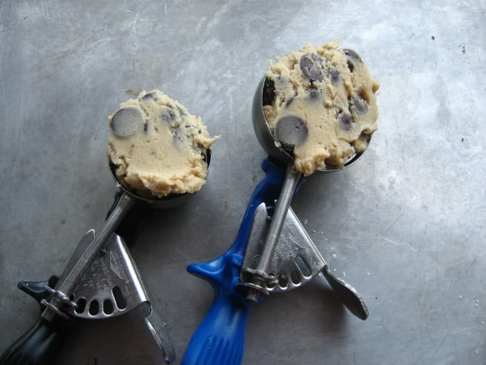 Portion cookie dough by using an ice cream scoop. There are different sizes to choose from.