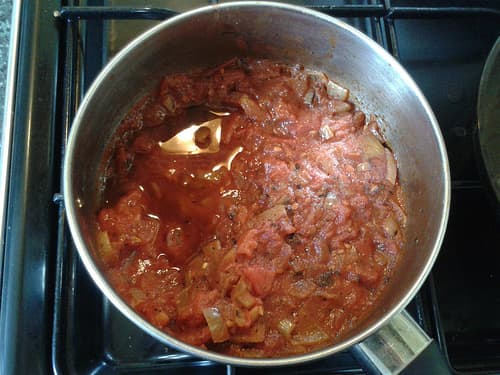 Onions, tomatoes and herbs are sufficient filling for several omelettes, or use the rest in another meal.
