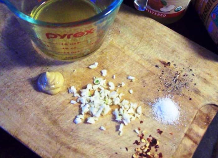 The vinaigrette is really simple: vinegar, olive oil, minced garlic, mustard, peppercorns and salt are all you need.