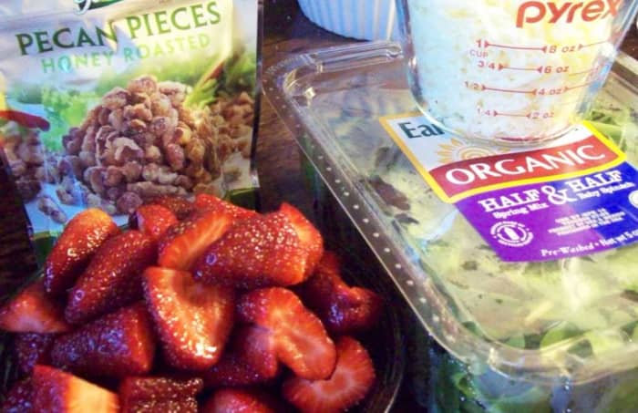 Strawberries, spring mix baby greens, pecans and a little bit of mozzarella make up this simple, yet delicious salad.