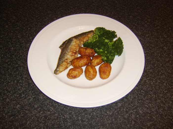 Herring loin fillets are floured and shallow fried before being served with pan roasted potatoes and broccoli