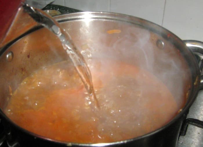 Add more water if necessary. The water should cover all of the ingredients.