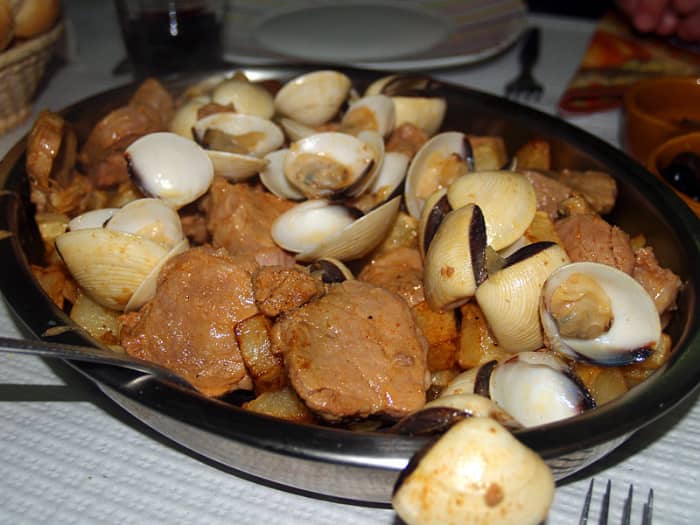 One of the most traditional and popular pork dishes of Portuguese cuisine. It is typical from the Alentejo region, in Portugal, hence the word Alentejana (from Alentejo) in its name. It is a combination of pork and clams, with potatoes and coriander.