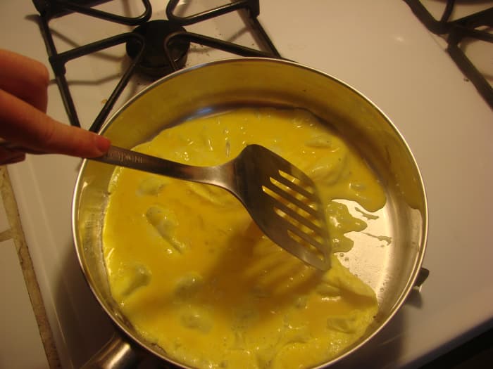 Once you pour the beaten egg mixture into sizzling oil, let it just sit on medium-high heat for about 30 seconds.
