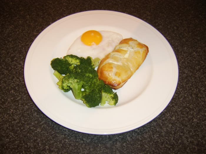 Ling fillet is wrapped and cooked in puff pastry before being served with a pan fried duck egg and some fresh broccoli