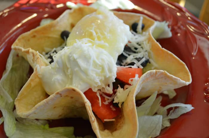 You can use tortilla bowls for breakfast dishes like delicious huevos rancheros.
