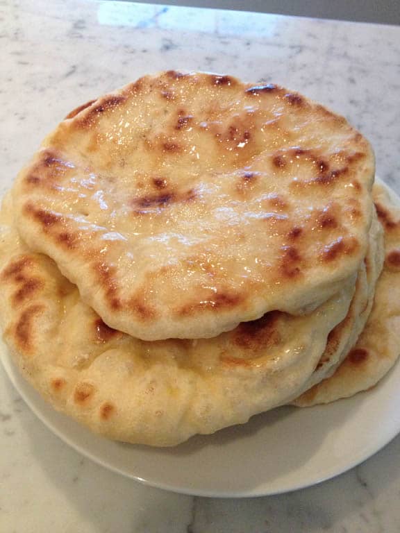 Cooking the naan in the skillet is very quick. Be sure to keep an eye on the burner so as not to burn the dough.