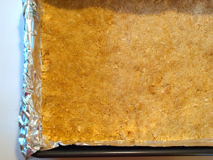 3. Spread the cookie crumbs evenly on the bottom of the 13x9 pan. Cool until ready to use.