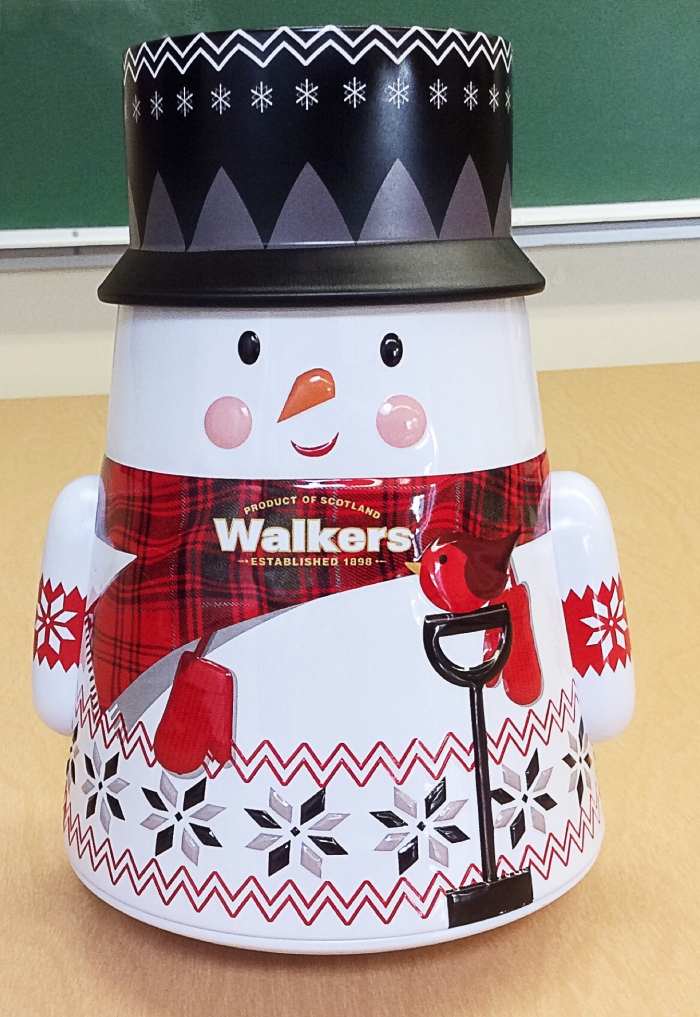 A wobbling snowman container filled with small cookies