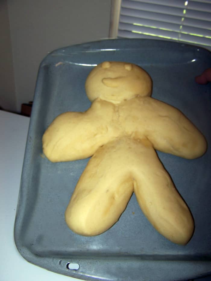 Here is the bread after the second rising. The dough is shaped like a man to represent the sacrificial Sun God, who gives his life each year at harvest to be reborn and bring back fertility in the spring.