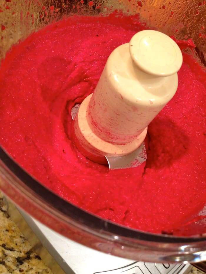 Process all ingredients until smooth. Add in reserved garbanzo been one teaspoon at a time liquid to thin, if desired.