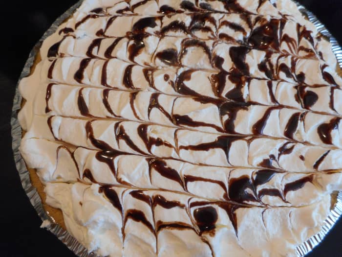 Drizzle with chocolate syrup and run a toothpick from one side to the other side for a pretty effect. For my pie, I started drizzling syrup in the center of the pie and swirled it until I reached the outer edge.