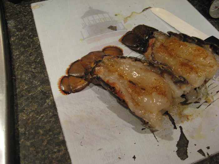 Spread out the shell, exposing the meat.