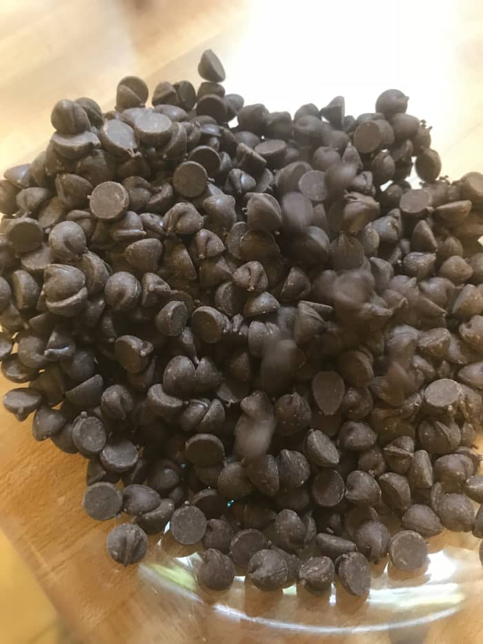 Place dark chocolate into a glass bowl. Be sure to use good-quality dark chocolate chips or high-quality baking bars and chop them finely before adding them to the bowl.