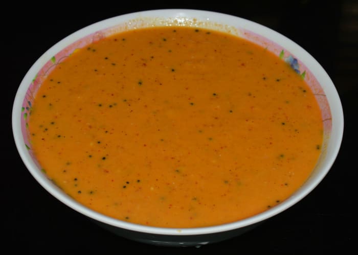 Step three: Add salt. Add curd if the mangoes are not at all tangy. Mix well. Adjust the consistency. Add a tempering to it, as per instructions. Mix well. Now, the raita is ready to serve.