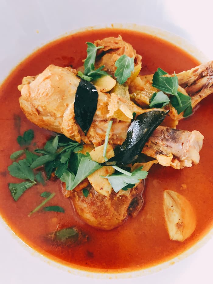 One of my favorite dishes to make at home is Malay-style chicken curry. The main ingredients are coconut milk, curry powder, curry leaves, chicken, and assorted spices.