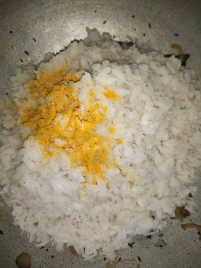 Add parboiled peas and potatoes. Mix. Add soaked and drained poha, turmeric powder, salt and a few crystals of sugar (if using).