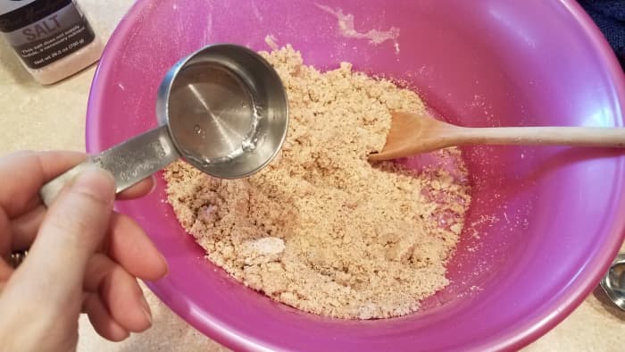 Then I dump it into a large bowl and add all of my other ingredients. If your dough isn't coming together, you may need a little more water.