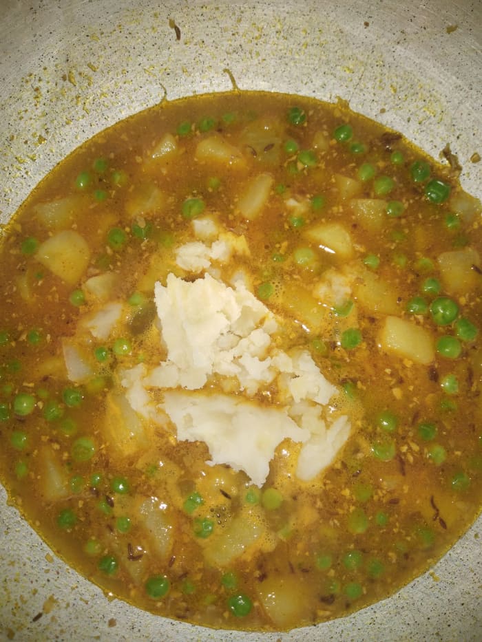 Add mashed potato to provide creamy texture to the curry. Adjust the consistency by adding water as needed.