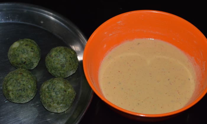Divide the dough into lemon-sized portions. Shape them into balls. Set the balls on a plate alongside the batter.
