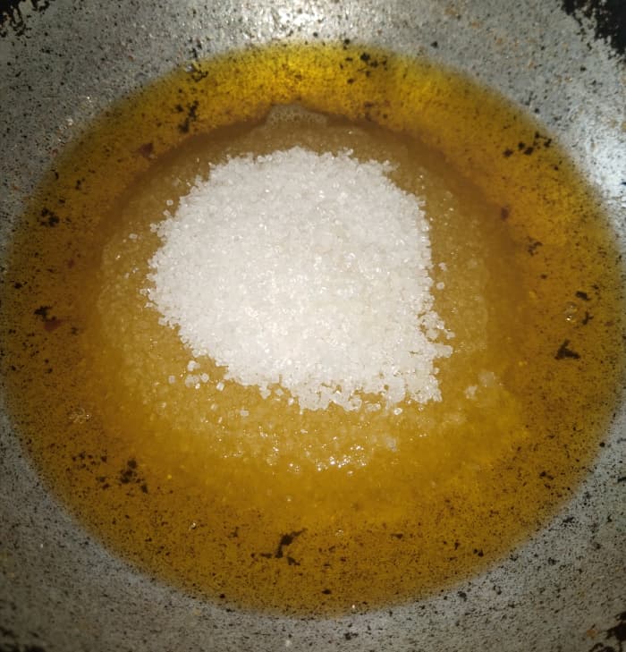 To this hot ghee add 1 cup of sugar. (You can adjust the amount according to your desired sweetness.)