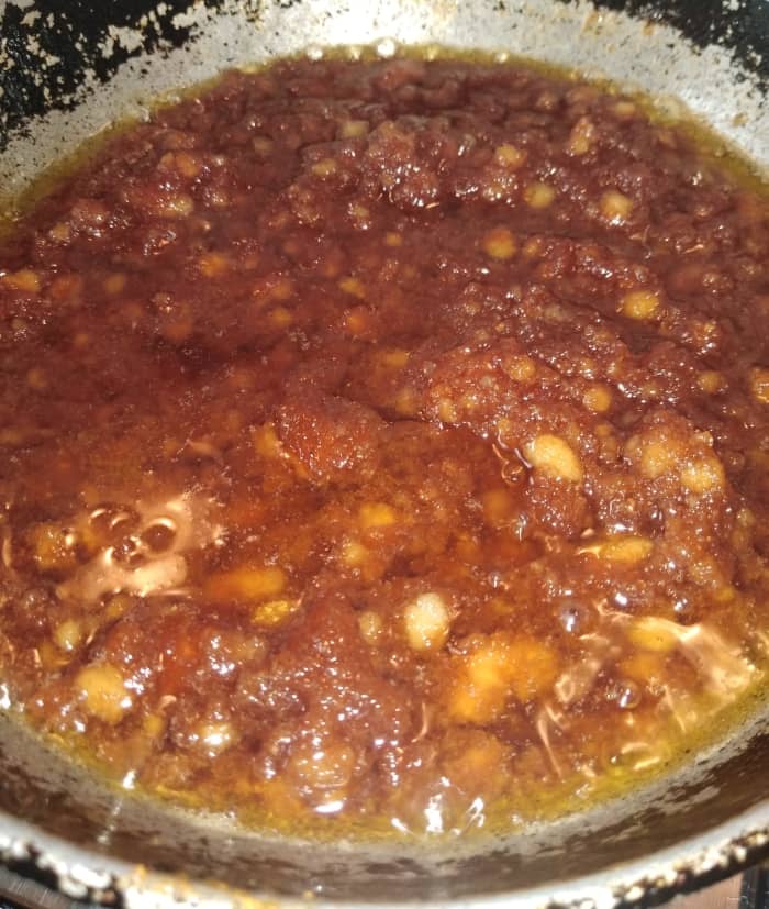Mix well so that no lumps form. Break up the lumps (if any) with a spoon. Stir for about 4-5 minutes till ghee separates from the sides.