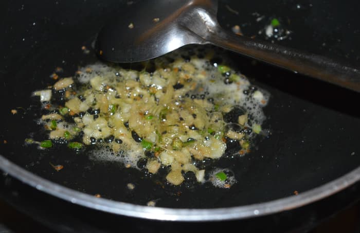 Step one: Cook barley as per instructions. Set aside. In a heated deep-bottomed pan, saute chopped garlic, ginger, and green chilies with butter until you get a nice aroma.