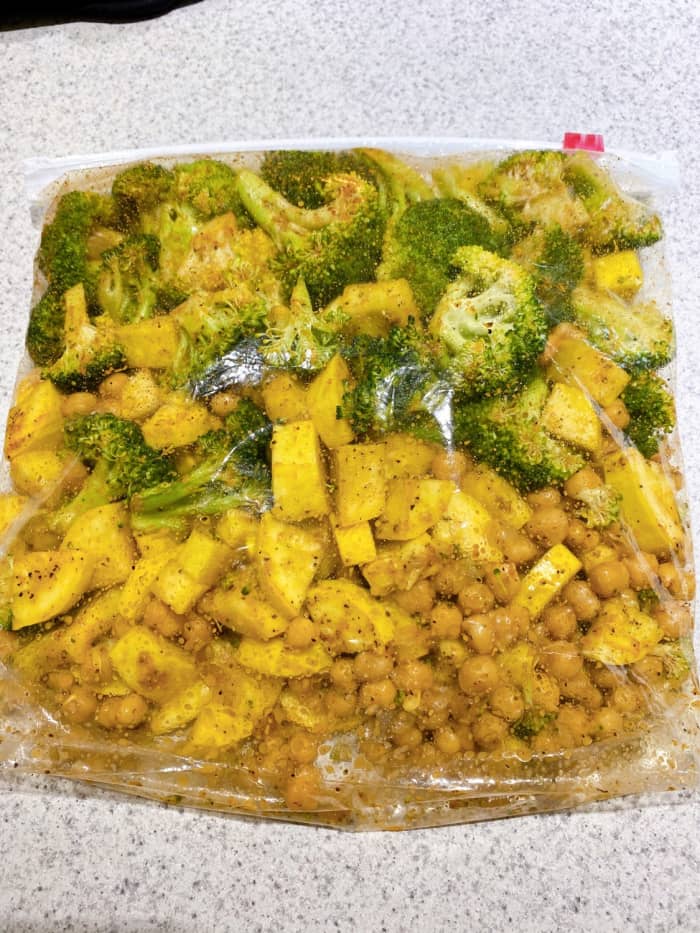 Add the olive oil and seasonings. Seal the bag and massage the contents together to ensure that seasonings are evenly distributed.