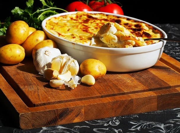 A creamy scalloped potato casserole with potatoes, milk, cheese and other flavorful ingredients.