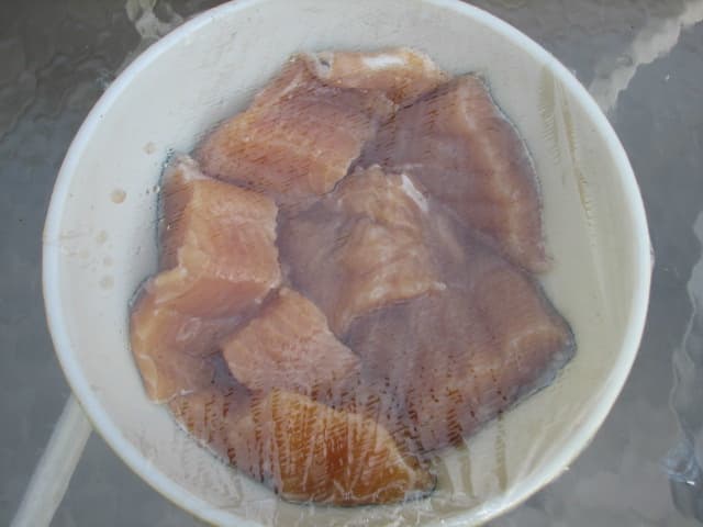The fish soaked all night in this covered dish . The marinade has been drained to put the liquid in the drip pan of the smoker.