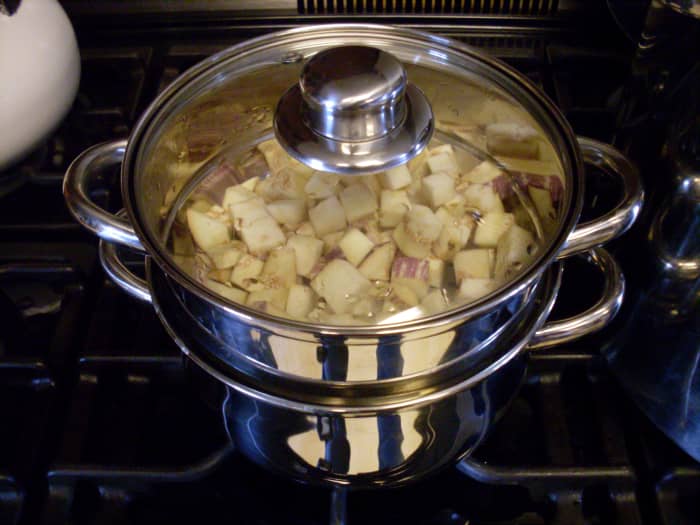 You may steam blanch your eggplant pieces 3 minutes, or boil them 1 minute. Add citric acid or Fruit Fresh to the water, to help the eggplants hold their color. Blanching is supposed to help vegetables keep better once frozen or dried.