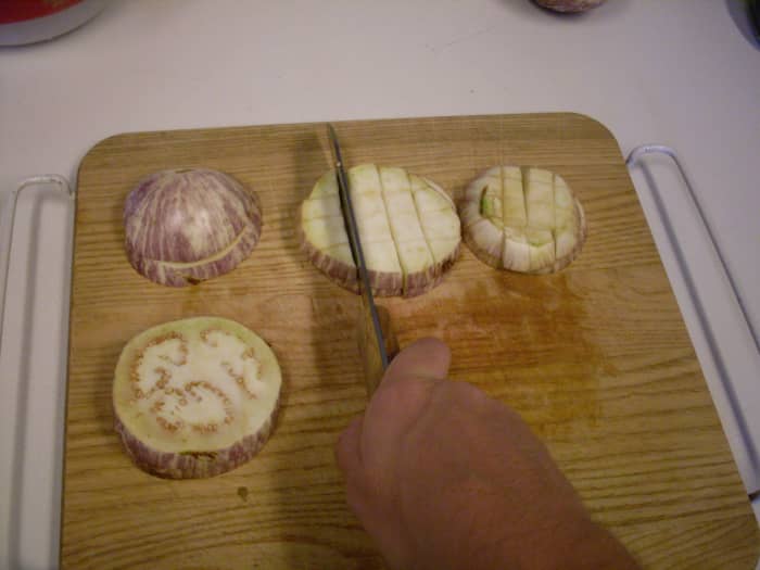 I have chosen to dice mine. You may slice them, or cut them into any shape you please. You may peel your eggplants, if you wish.