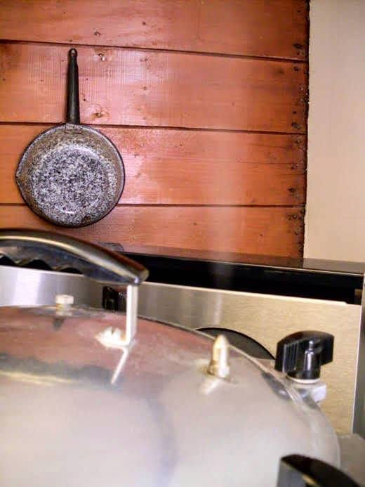 Heat on low/medium heat until the steam vent is hissing and spitting, then wait 10 minutes to place the weight for 10 pounds of pressure. Waiting ensures the canner is properly pressurized. Process for 80 minutes, then turn off the heat and cool comp