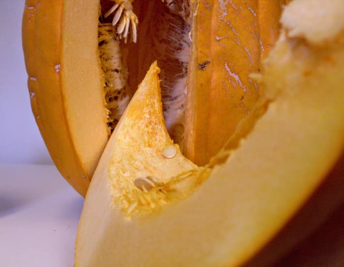 ... to cut neat wedges of golden pumpkin. Pause to admire the beautiful, golden cave all hung with roastable seeds.