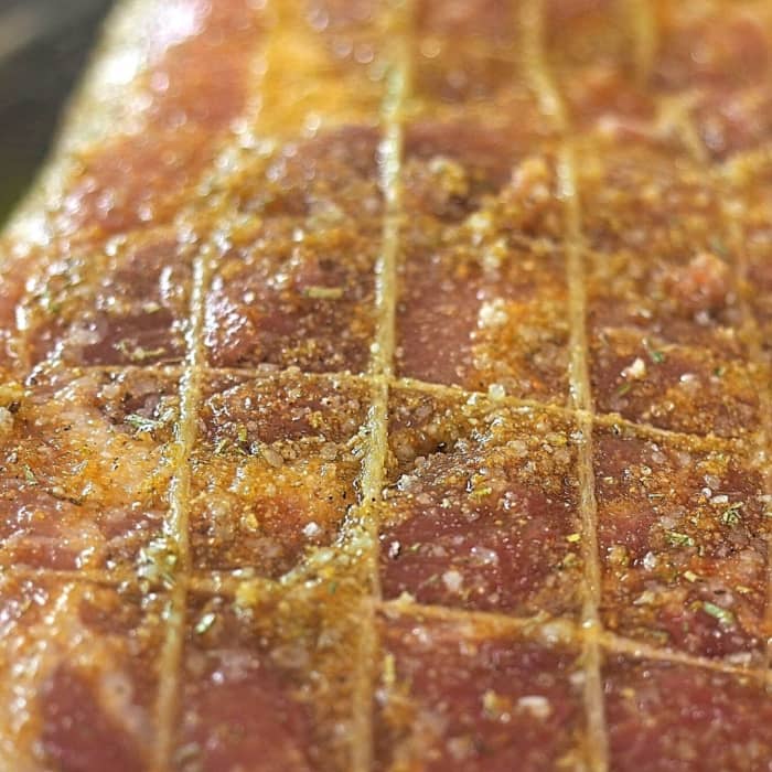 Once the pork roast is covered in olive oil and spices—sea salt, ground rosemary, and garlic powder—it's ready for the oven!