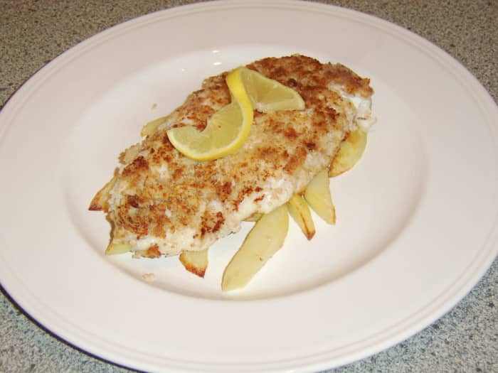 A Scottish fish supper features battered haddock and chips. This is a healthier version of the meal that uses breadcrumbs.