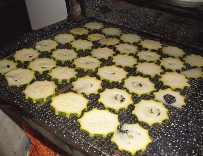 If you have a hot fire going, move your tray to the oven door so it doesn't burn. Turn the trays periodically, so the side next to the firebox doesn't get too hot.