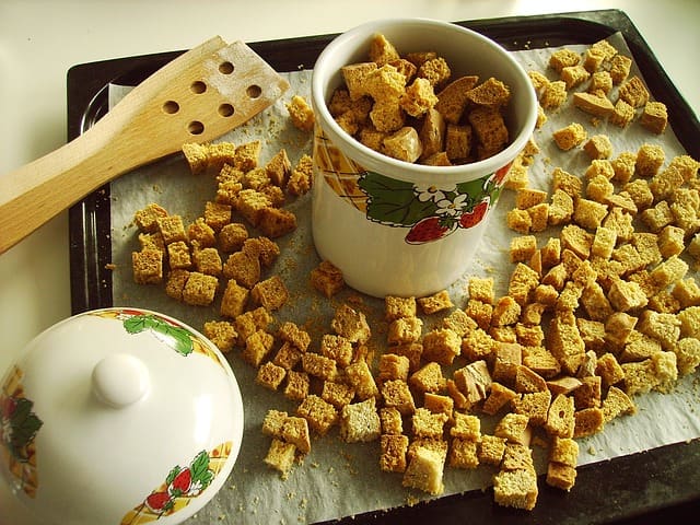 Croutons dry and crisp up as they sit. If you make a good-sized batch, these can be stored dry.