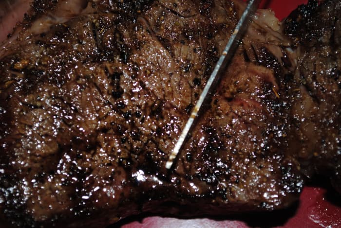 This is a perfectly grilled rib eye steak. See the knife blade? Couldn't keep my diners out of the food long enough to just snap a picture!
