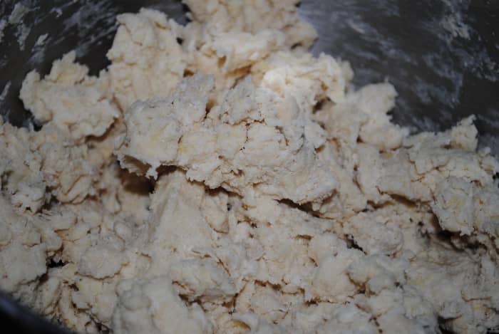 Once the egg and buttermilk are added - the dough will begin to come together. If you're using a mixer, stop when it looks like this. Here is where you begin to knead.