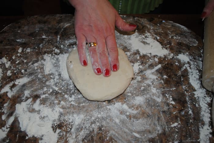On a floured surface, pat the dough into a disk. I divide the dough into two batches. It's just a little easier to work with.