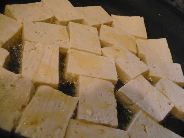 Pan fry tofu rectangles to retain shape and form as they tend to break apart otherwise. In the same way, fry tofu (no corn flour needed) until golden brown.